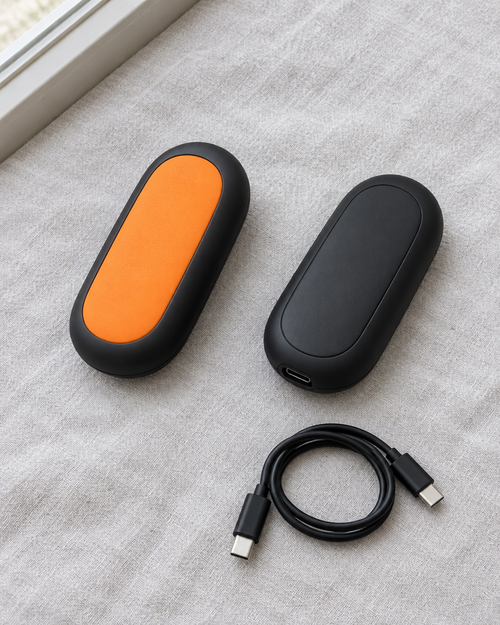 Embra Duo pair on linen showing the heating face, the back and the USB-C cable